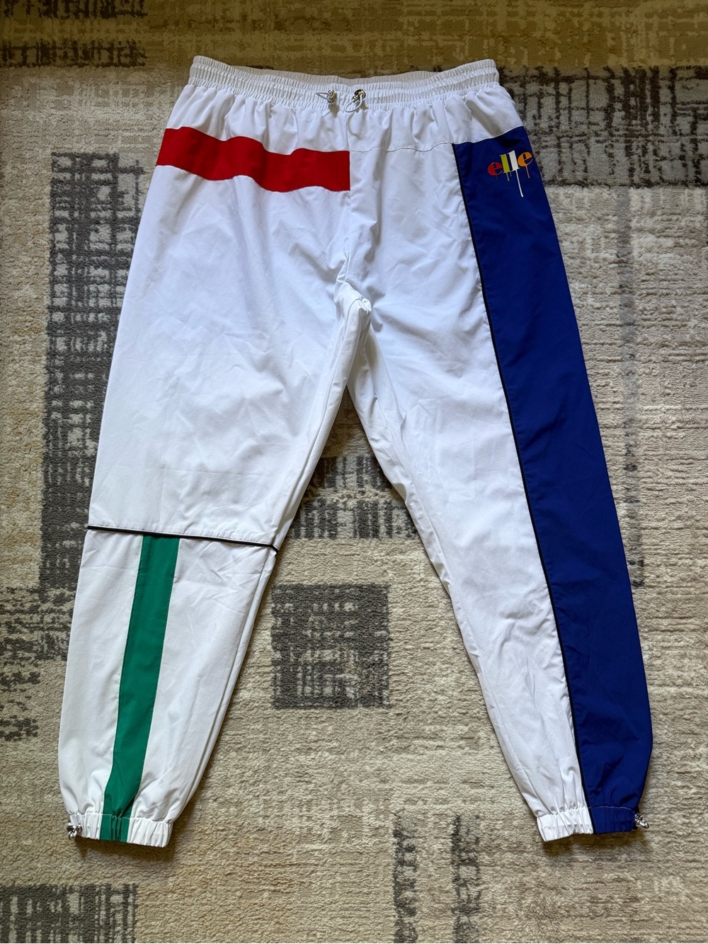 Ellesse White Track Pants with Blue, Red & Green Accents